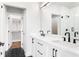 Bathroom featuring dual sinks, modern fixtures, and a walk-in shower at 7210 Summit Pl, Alpharetta, GA 30009