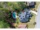 Aerial view of a beautiful home with a large backyard featuring a private pool and mature trees in a cul-de-sac at 1450 Chadberry Way, Lawrenceville, GA 30043