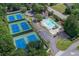 Aerial view of a community featuring a swimming pool, tennis courts, and convenient parking for residents at 1450 Chadberry Way, Lawrenceville, GA 30043