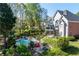 Stunning backyard featuring a sparkling pool, hot tub, outdoor fire pit, and a covered patio at 1450 Chadberry Way, Lawrenceville, GA 30043