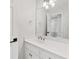 Bathroom with white vanity, gold hardware and a large mirror at 1450 Chadberry Way, Lawrenceville, GA 30043