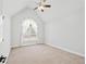 Bright bedroom with vaulted ceiling, neutral carpet, and a modern ceiling fan at 1450 Chadberry Way, Lawrenceville, GA 30043