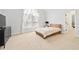 Bedroom with neutral carpet and a wooden bed frame with access to another room at 1450 Chadberry Way, Lawrenceville, GA 30043