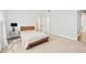 Bedroom with neutral carpeting and a wooden bed frame and access to an ensuite bathroom at 1450 Chadberry Way, Lawrenceville, GA 30043