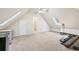 Bonus room with vaulted ceiling, storage space, and carpeted floors at 1450 Chadberry Way, Lawrenceville, GA 30043