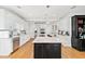 Contemporary kitchen featuring a center island, granite counters, stainless steel appliances, and ample cabinet space at 1450 Chadberry Way, Lawrenceville, GA 30043