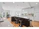 Eat-in kitchen area showcasing a large island with bar seating, stainless steel appliances, and plenty of natural light at 1450 Chadberry Way, Lawrenceville, GA 30043