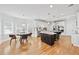 Bright and airy eat-in kitchen boasts stainless steel appliances, island with bar seating, and multiple windows at 1450 Chadberry Way, Lawrenceville, GA 30043