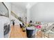 Bright living room featuring hardwood floors, fireplace, grand staircase and soaring ceilings with a glamorous chandelier at 1450 Chadberry Way, Lawrenceville, GA 30043