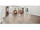 Open living room with luxury chairs, curated furniture, and bright windows at 1450 Chadberry Way, Lawrenceville, GA 30043