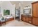 Elegant bathroom featuring a soaking tub, walk-in shower with glass door, and granite countertops at 1450 Chadberry Way, Lawrenceville, GA 30043
