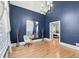 Bright office with large windows, hardwood floors, and a stylish chandelier at 1450 Chadberry Way, Lawrenceville, GA 30043