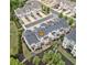 Townhome community with meticulously maintained landscaping featuring trees, shrubs, mulch, and green lawns at 207 Magnolia Creek Way, Woodstock, GA 30188