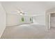 Very large bedroom with natural lighting, carpet, a ceiling fan, and an en-suite bathroom at 207 Magnolia Creek Way, Woodstock, GA 30188