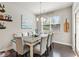 Charming dining room with stylish seating, natural light, and access to the outdoor area at 207 Magnolia Creek Way, Woodstock, GA 30188