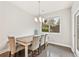 Dining room with a table and chairs next to the window and a door to the outside at 207 Magnolia Creek Way, Woodstock, GA 30188