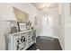 Beautiful foyer with shiplap accent wall, elegant lighting, and stylish console table at 207 Magnolia Creek Way, Woodstock, GA 30188