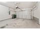 Spacious two car garage with concrete flooring, white walls, and standard garage door at 207 Magnolia Creek Way, Woodstock, GA 30188