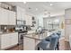 Stylish kitchen boasts granite countertops, stainless steel appliances, and a breakfast bar at 207 Magnolia Creek Way, Woodstock, GA 30188