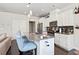 Modern kitchen featuring a large island with seating, white cabinets, and stainless steel appliances at 207 Magnolia Creek Way, Woodstock, GA 30188