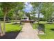 Picturesque park featuring a gazebo, fountain, benches, and lush green grass beneath mature trees offering shaded seating at 207 Magnolia Creek Way, Woodstock, GA 30188