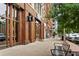 The commercial building has an entrance lined with wood with sidewalks and trees for a comfortable walk at 207 Magnolia Creek Way, Woodstock, GA 30188