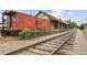 Train car with railroad tracks, and a vintage station at 207 Magnolia Creek Way, Woodstock, GA 30188