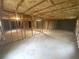 Unfinished basement with insulated ceiling and framed walls, offers potential for customization at 392 Beranda Cir, Douglasville, GA 30134