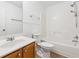 Clean bathroom featuring a white bathtub, shower, and a wood vanity sink at 392 Beranda Cir, Douglasville, GA 30134