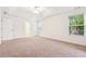 Bedroom featuring neutral walls, carpeting, and ample natural light from the large window at 392 Beranda Cir, Douglasville, GA 30134