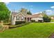 Lovely single-story home with green lawn and landscaping at 392 Beranda Cir, Douglasville, GA 30134