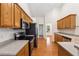 Well-equipped kitchen featuring stainless steel appliances, sleek countertops, and ample wooden cabinetry at 392 Beranda Cir, Douglasville, GA 30134