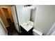 Well-lit bathroom features modern vanity, light fixture, and clean fixtures at 4134 Rogers Creek Ct # 41, Duluth, GA 30096