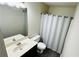 Bathroom featuring vanity with mirror, toilet, and shower with white shower curtain offering both style and functionality at 4134 Rogers Creek Ct # 41, Duluth, GA 30096
