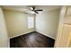 Bright bedroom with ceiling fan, wood floors, and nice natural lighting at 4134 Rogers Creek Ct # 41, Duluth, GA 30096