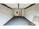 Clean, spacious garage with storage shelves ready for use at 4134 Rogers Creek Ct # 41, Duluth, GA 30096