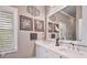 Bathroom includes double vanity sinks with stylish fixtures and a large mirror at 55 Hazelbrook Way, Acworth, GA 30101