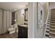 Well-lit bathroom features stone floor, vanity with mirror and shower-tub combination at 55 Hazelbrook Way, Acworth, GA 30101