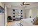 Bright bedroom with hardwood floors, ceiling fan, accent chair and natural light at 55 Hazelbrook Way, Acworth, GA 30101