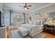 Comfortable bedroom with a ceiling fan, area rug, and hardwood floors at 55 Hazelbrook Way, Acworth, GA 30101