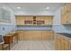 Well-lit craft room with ample counter space, custom cabinets, and stylish floral accents, ideal for creative projects at 55 Hazelbrook Way, Acworth, GA 30101