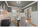 Elegant dining room with wainscoting, stylish chandelier, and ample natural light at 55 Hazelbrook Way, Acworth, GA 30101