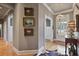 Inviting foyer with hardwood floors, elegant lighting, and decorative artwork at 55 Hazelbrook Way, Acworth, GA 30101