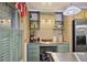 Butler's pantry area with custom desk and cabinetry with stainless steel refrigerator in the background at 55 Hazelbrook Way, Acworth, GA 30101