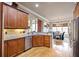 Bright kitchen with wood cabinets, modern appliances, and an adjacent dining area at 55 Hazelbrook Way, Acworth, GA 30101