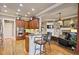 Open kitchen with granite countertops, stainless steel appliances, and bar seating at 55 Hazelbrook Way, Acworth, GA 30101