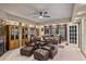 Inviting living room featuring leather seating, a cozy fireplace, and elegant built-in cabinets, providing a comfortable space at 55 Hazelbrook Way, Acworth, GA 30101