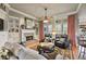 Spacious living room featuring a cozy fireplace and abundant natural light at 55 Hazelbrook Way, Acworth, GA 30101