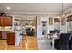 Open concept kitchen and dining area with hardwood floors and modern design at 55 Hazelbrook Way, Acworth, GA 30101