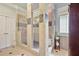 Elegant tiled shower, includes a built-in seat and glass door at 55 Hazelbrook Way, Acworth, GA 30101